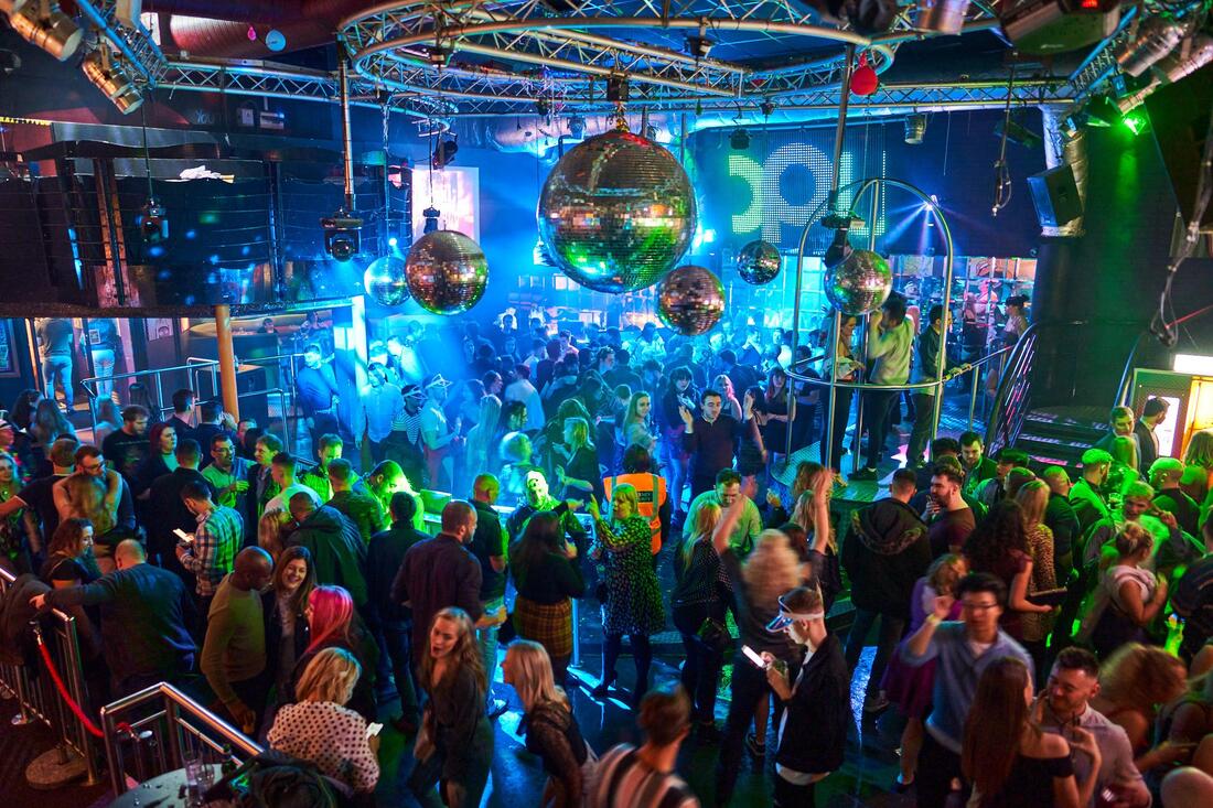 People partying inside the nightclub Popworld